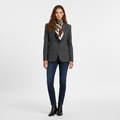 Grey tailored single button blazer worn with a printed scarf and jeans, front view