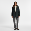 Green checked double breasted blazer worn over a cream knit, front view